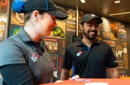 Dominos staff clapping together